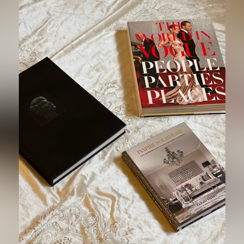 Three decorative books.